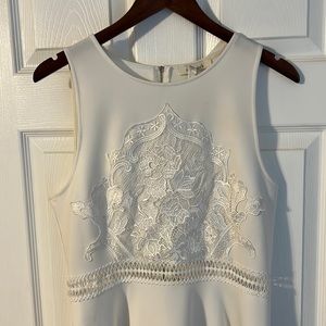 Francesca’s white lace detail dress with gold zipper